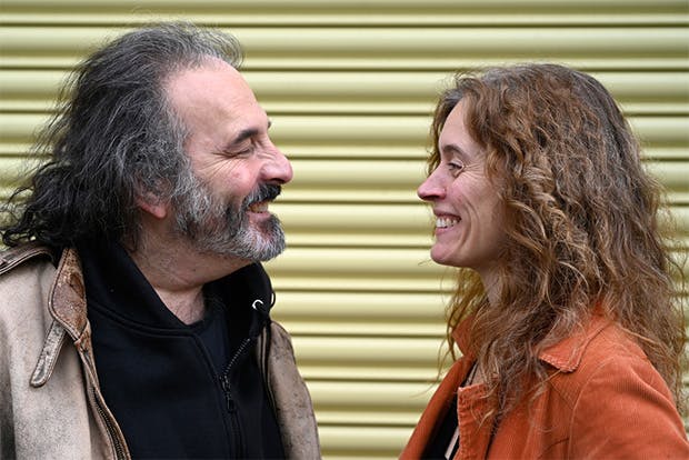 Portrait of drummer Tony Bianco and violinist Faith Brackenbury facing each other smiling