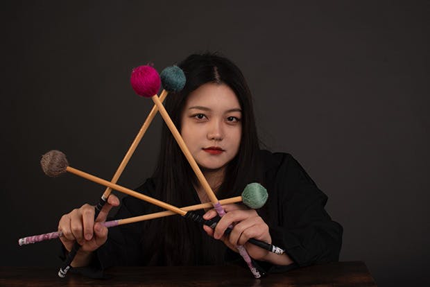 Chuling Ye holding percussion mallets