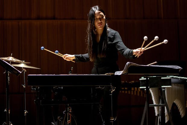 Female percussionist playing tuned percussion
