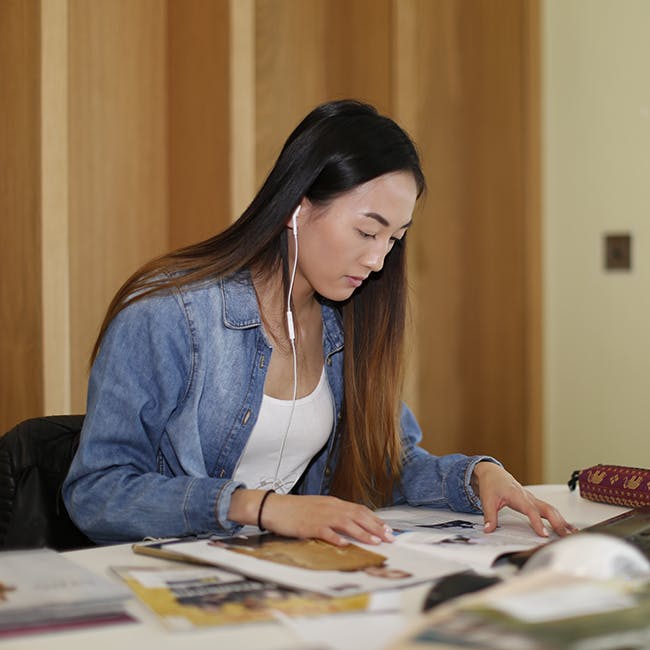 student at work in library