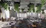A modern restaurant with plants hanging from the ceiling