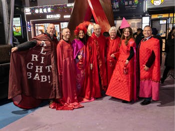 Key contributors to the Birmingham AIDS and HIV memorial - 'The Ribbons' - wearing the cloaks specially designed by School of Fashion & Textiles students at the memorial unveiling on World AIDS Day. 