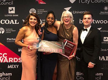 Birmingham City University representatives collecting their award for excellence in diversity and inclusion.