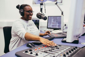 A student using the radio studio