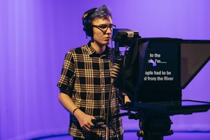 Student operating camera in Studio A