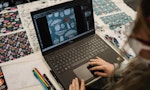 A student planning a textile in Photoshop