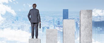 Centre for Enterprise, Innovation and Growth Homepage Image 341x140 - Man stood on building blocks looking at a city