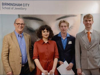 Competition winner and BCU student Marcus Laing (third from left) alongside runners up receiving their prizes from Christopher Ward CEO Mike France (left of group)