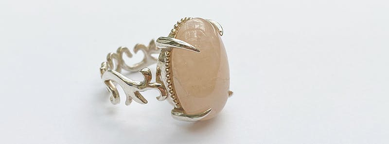Decorative ring with pink gemstone