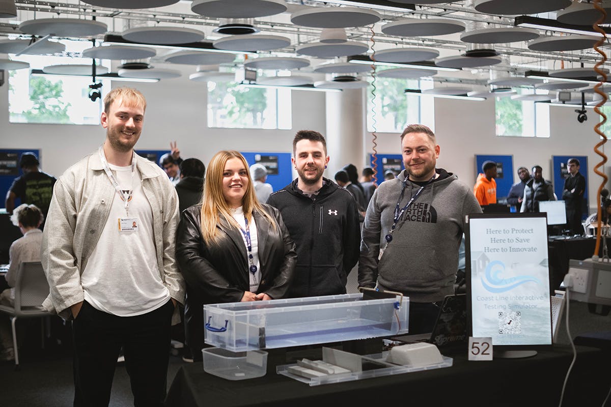 Image of one of the groups from Innovation Festival 2022, where they developed an interactive coast line testing simulator.