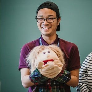 Student working with puppet