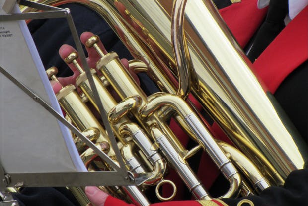 Close up of person playing euphonium