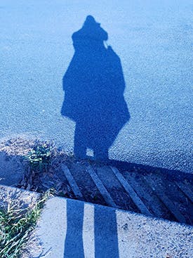 Shadow of someone carrying something