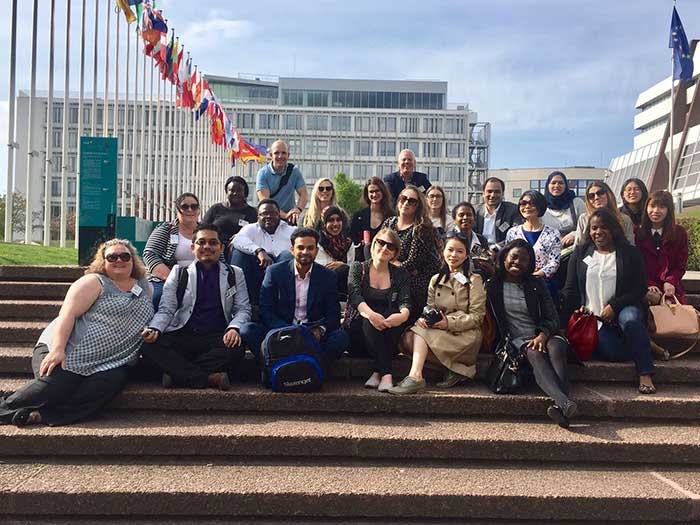 International PG Study Trip Germany 2017 700x525 - Students sat on steps