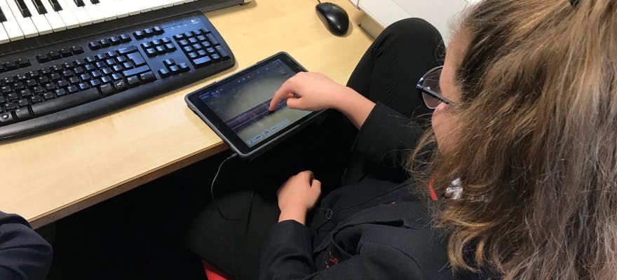 Student using an iPad to make music