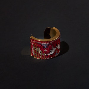 Jewellery and Objects student work -- ring with red tapestry