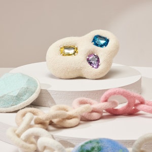 A chain made from felt along with mock gemstones also made from felt