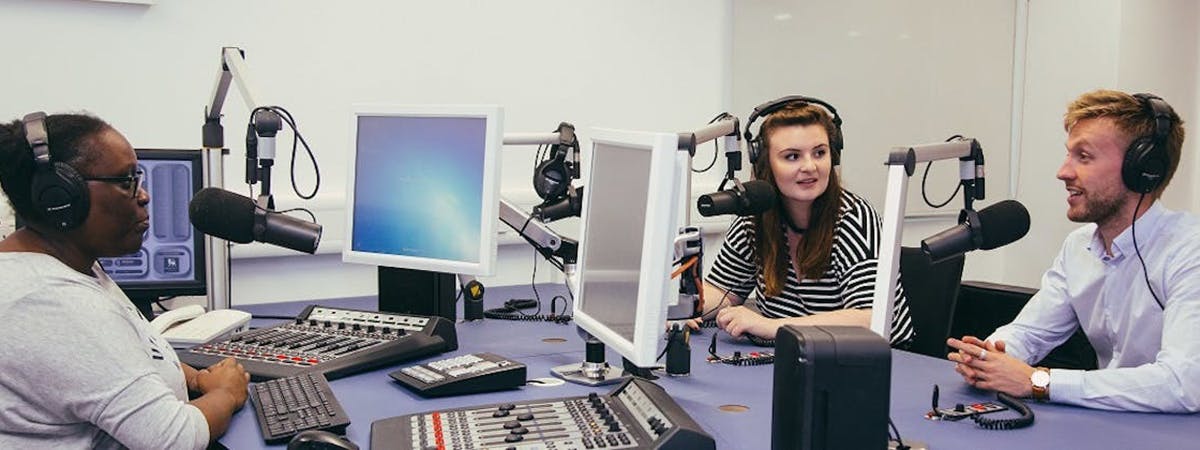 Journalism students working in radio studio
