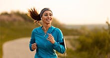 A woman jogging while listening to music