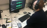 A person editing recorded audio