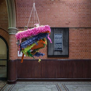 Margaret Street Atrium with large piñata type sculpture hanging from ceiling