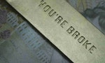 A money clip with the engraving "You're broke"