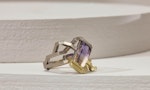A square ring with a purple jewel