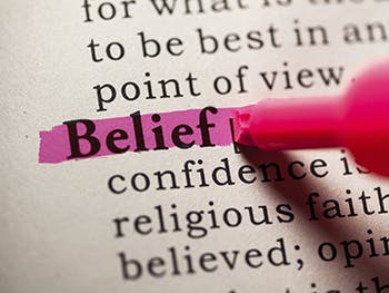 Pen highlights 'Belief' in dictionary