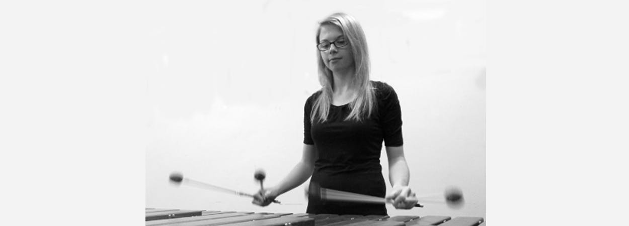 Miriam Kitchener – Graduated with BMus in 2016 and MMus in 2018, black and white image of her playing the xylophone