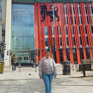 Murrissa Gitau standing in front of Curzon Building