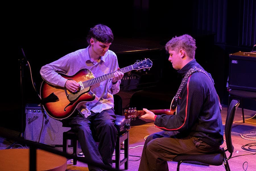 Joe Hiles and James Coni playing guitar