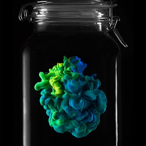 Photography piece of colourful animation in glass container