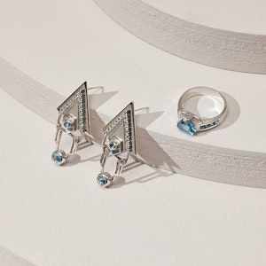 Jewellery and Silversmithing HND student work of silver ring and earrings with blue jewel
