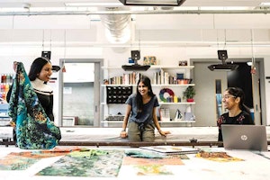 three students in textile design room 
