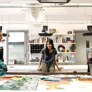 three students in textile design room 