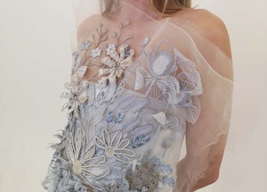 model wearing white patterned dress