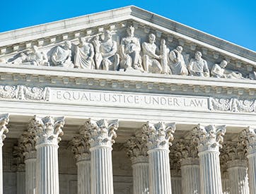 US Supreme Court with "Equal Justice Under Law" engraved on the front