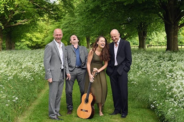 Vida Guitar Quartet standing in an English countryside